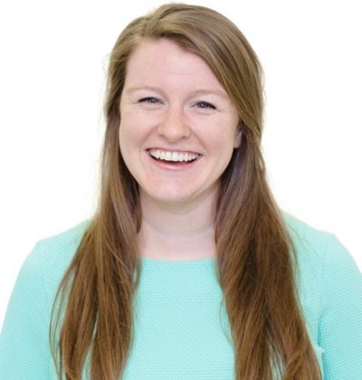 Headshot of Jen smiling wearing a green top